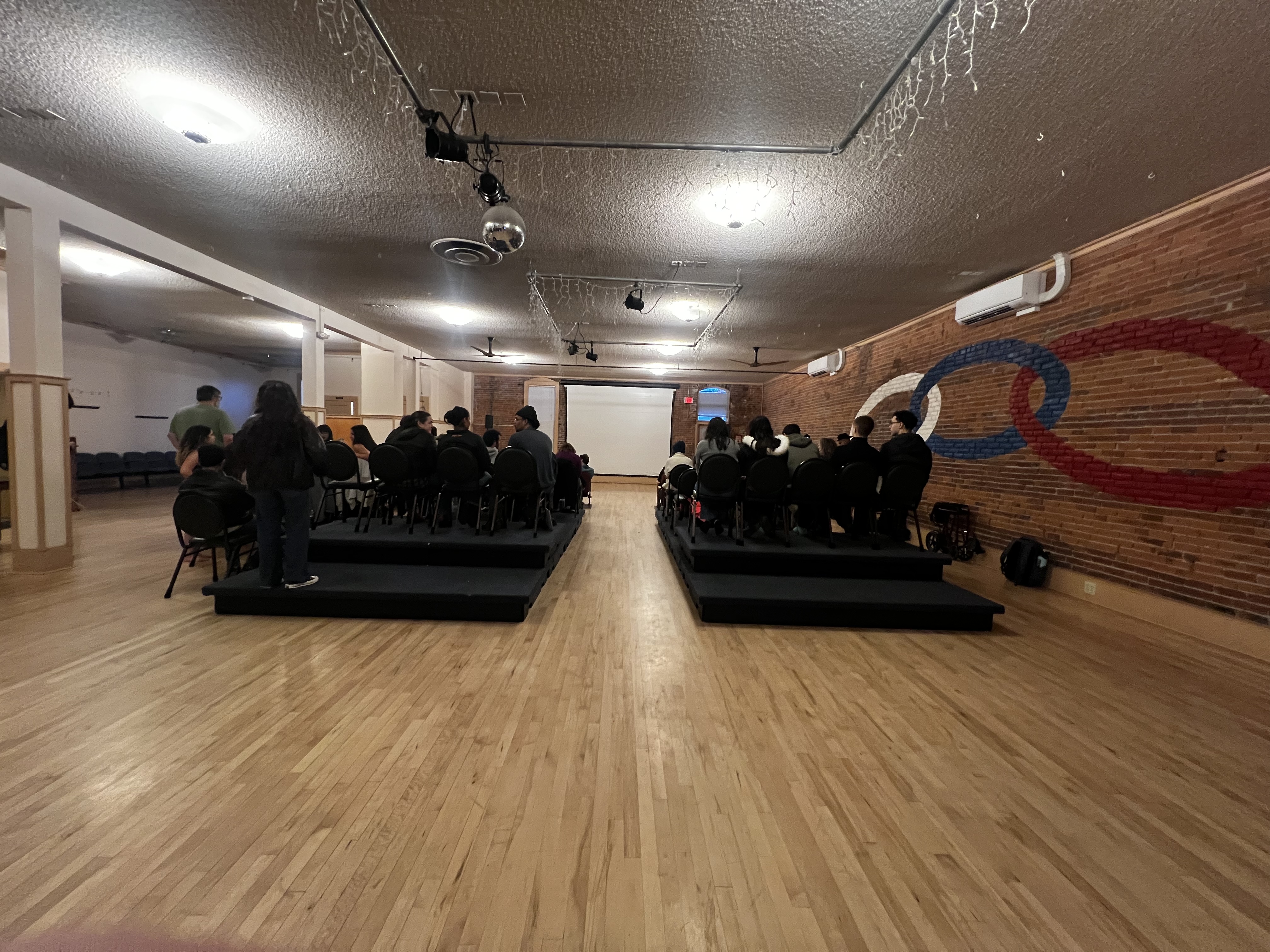 Film screening with stage risers in the Friendship Hall