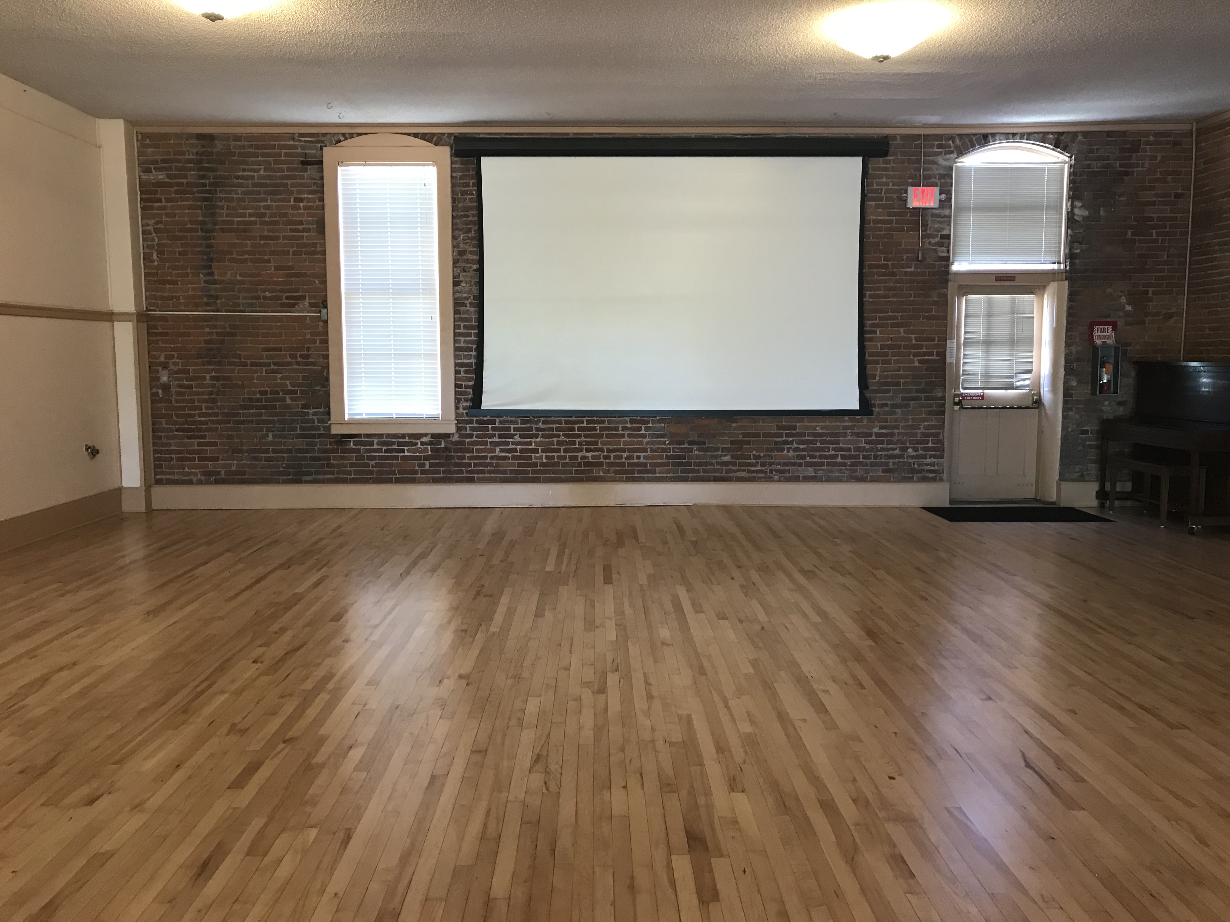 Friendship Hall — empty floor with projection screen